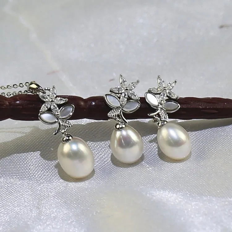 pair of pearl necklace and earrings displaying pearl jewellery collection