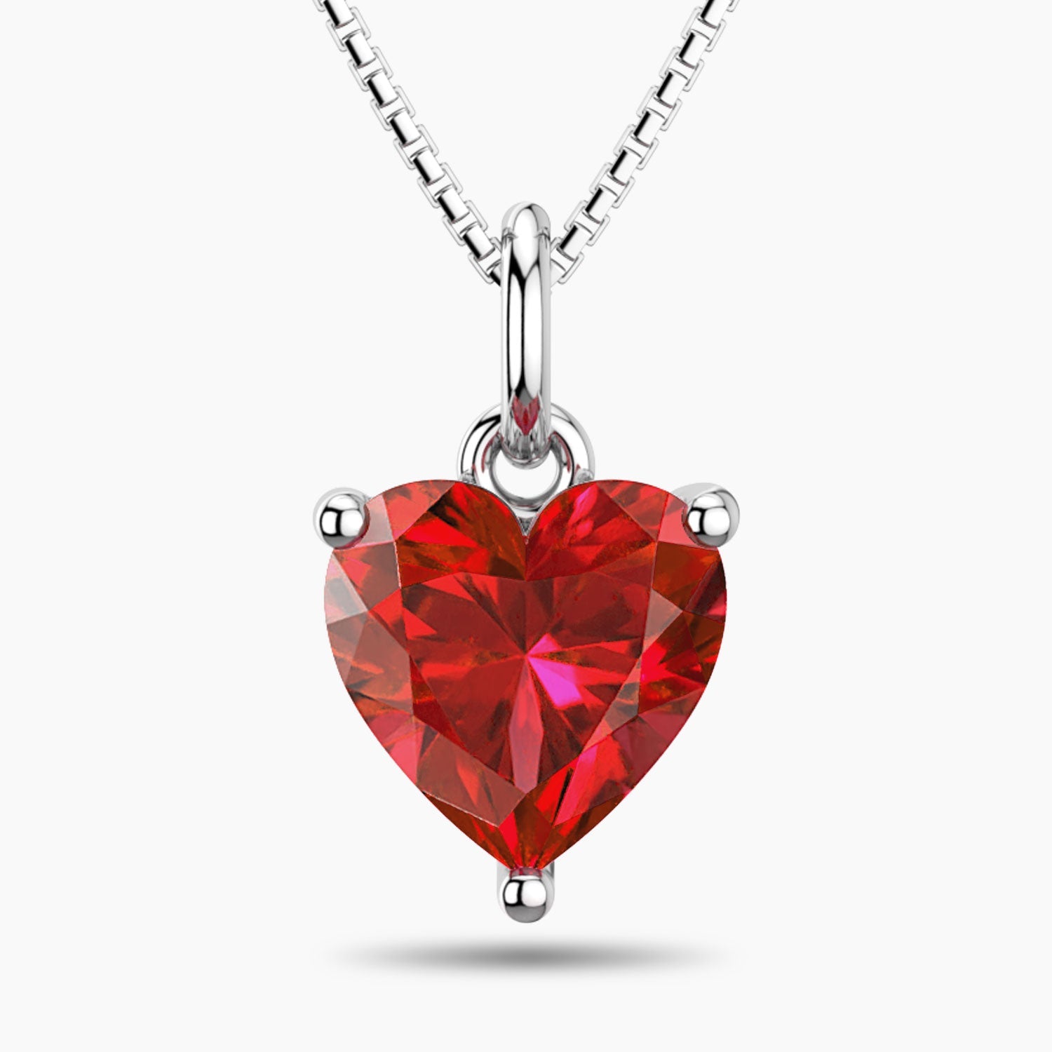 image of rubyt heart in silver with light background