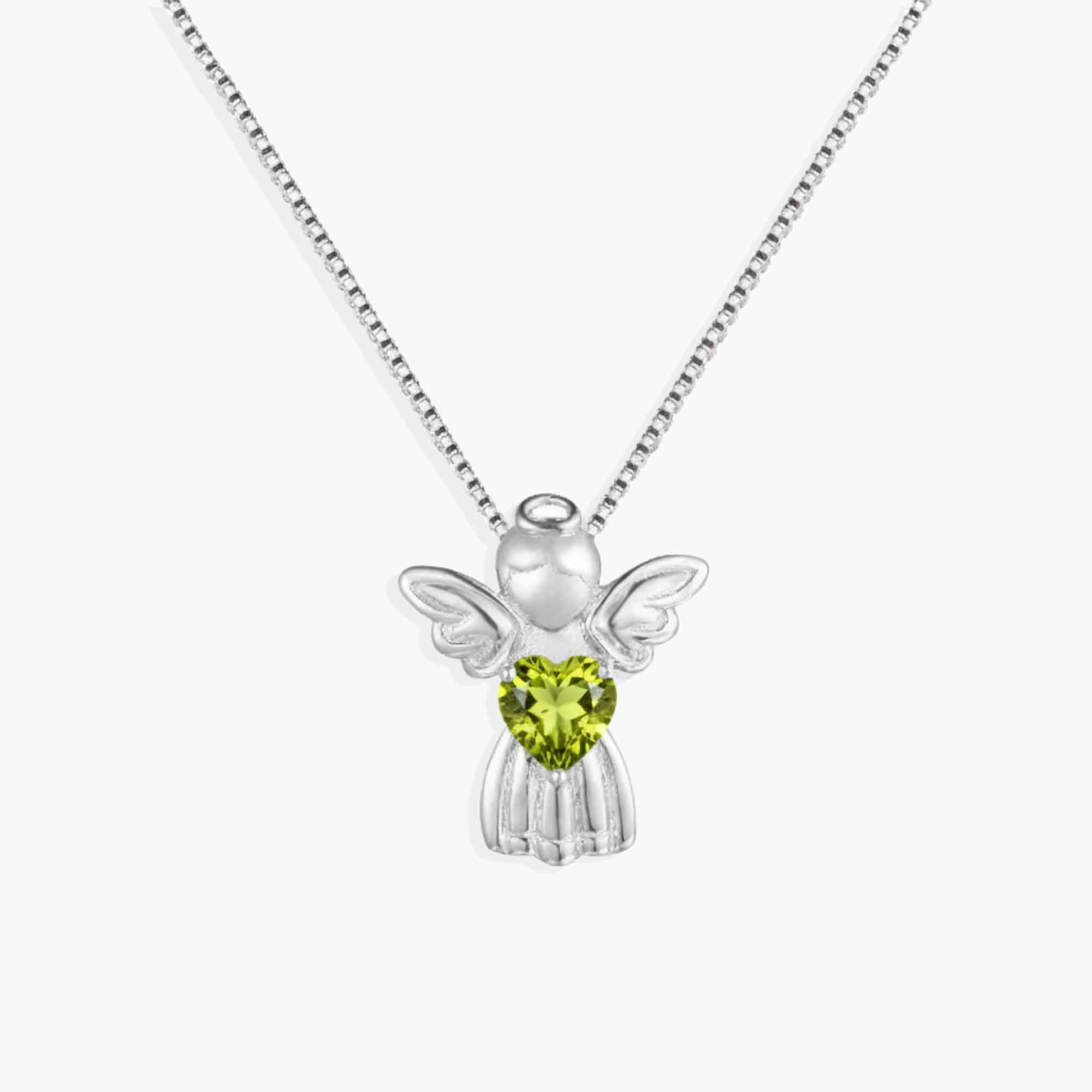 Silver angel pendant with a green heart-shaped gemstone on a white background