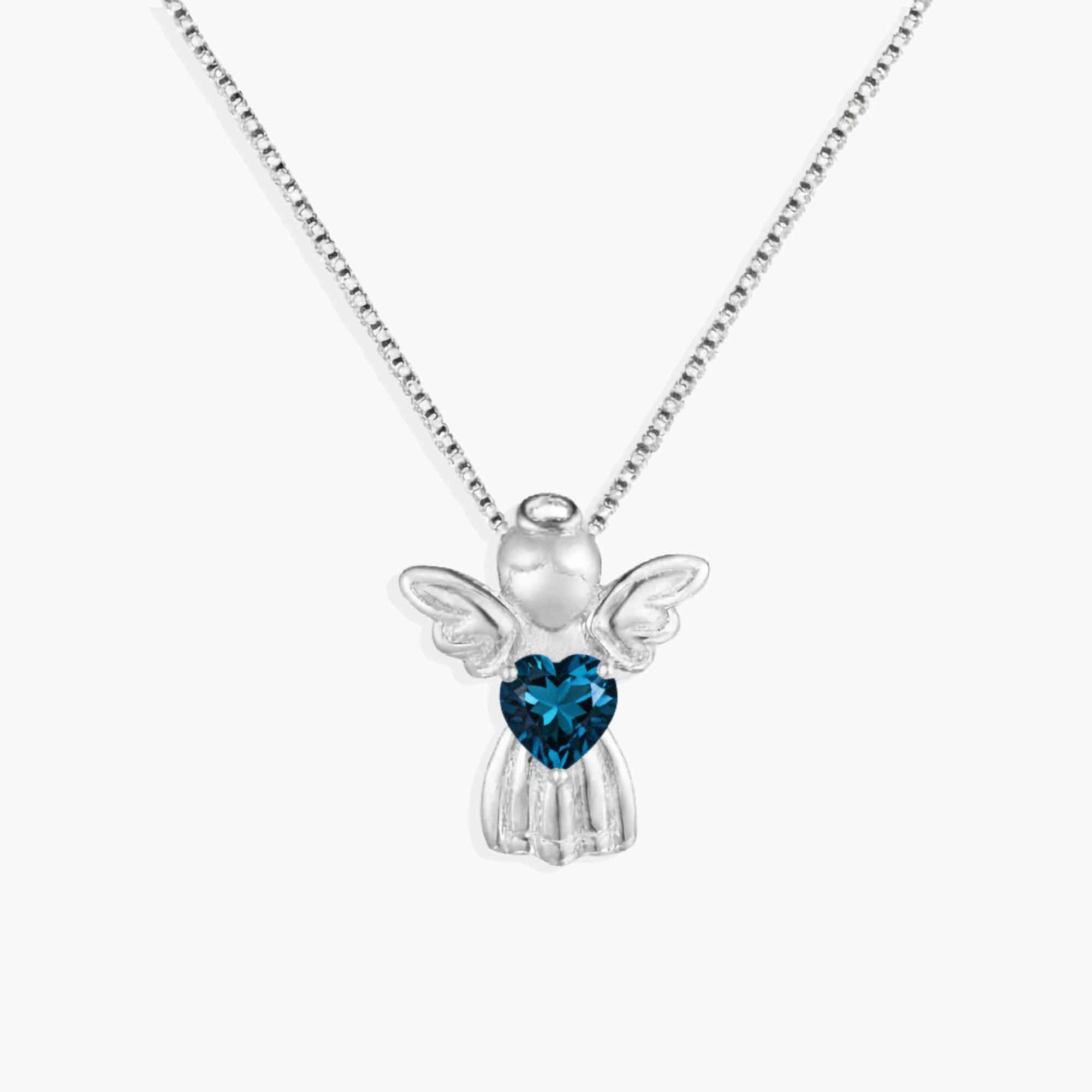 Silver angel pendant with a blue topaz heart-shaped gem on a white background