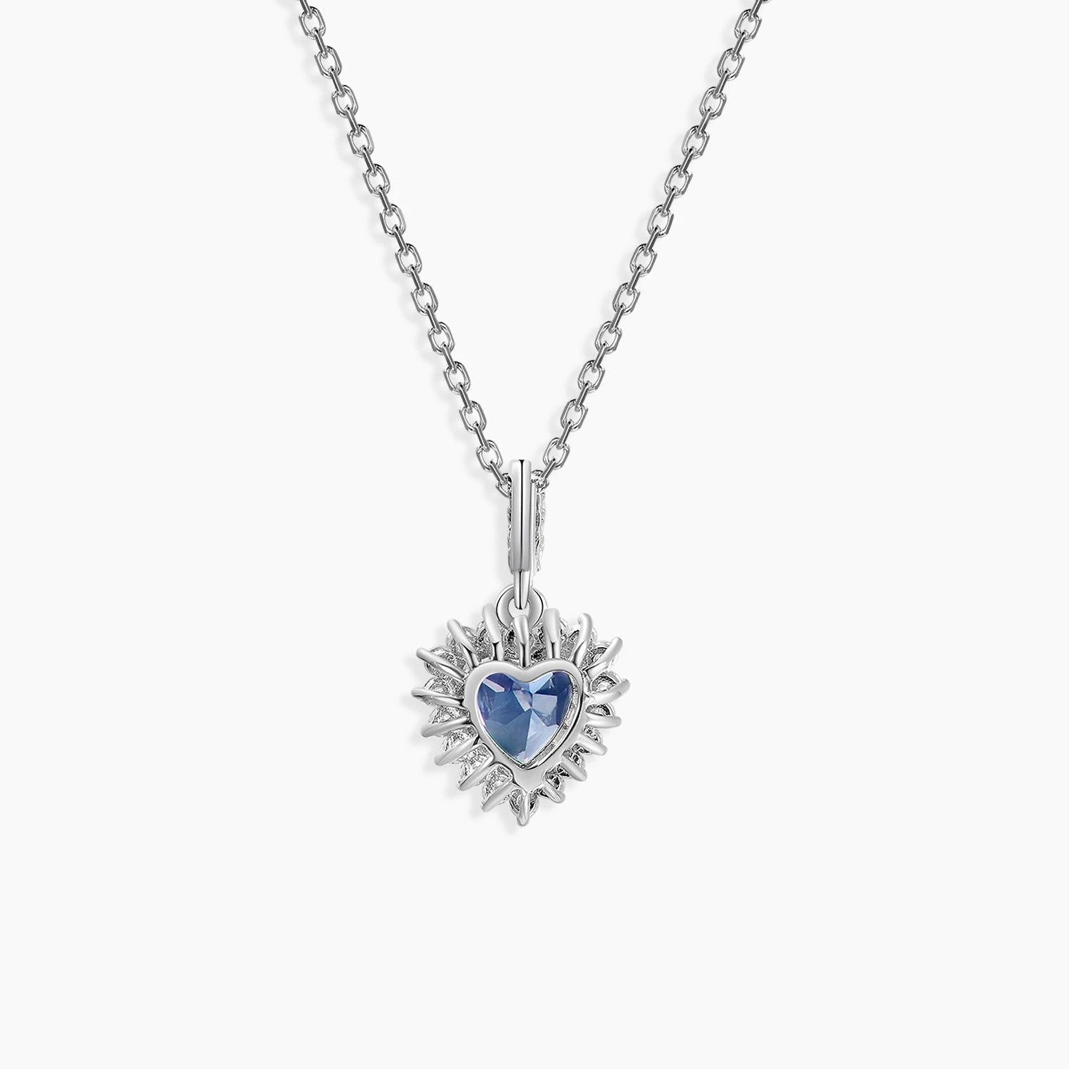 Back side Close-up of heart-cut Alexandrite pendant necklace with halo setting and white gold look