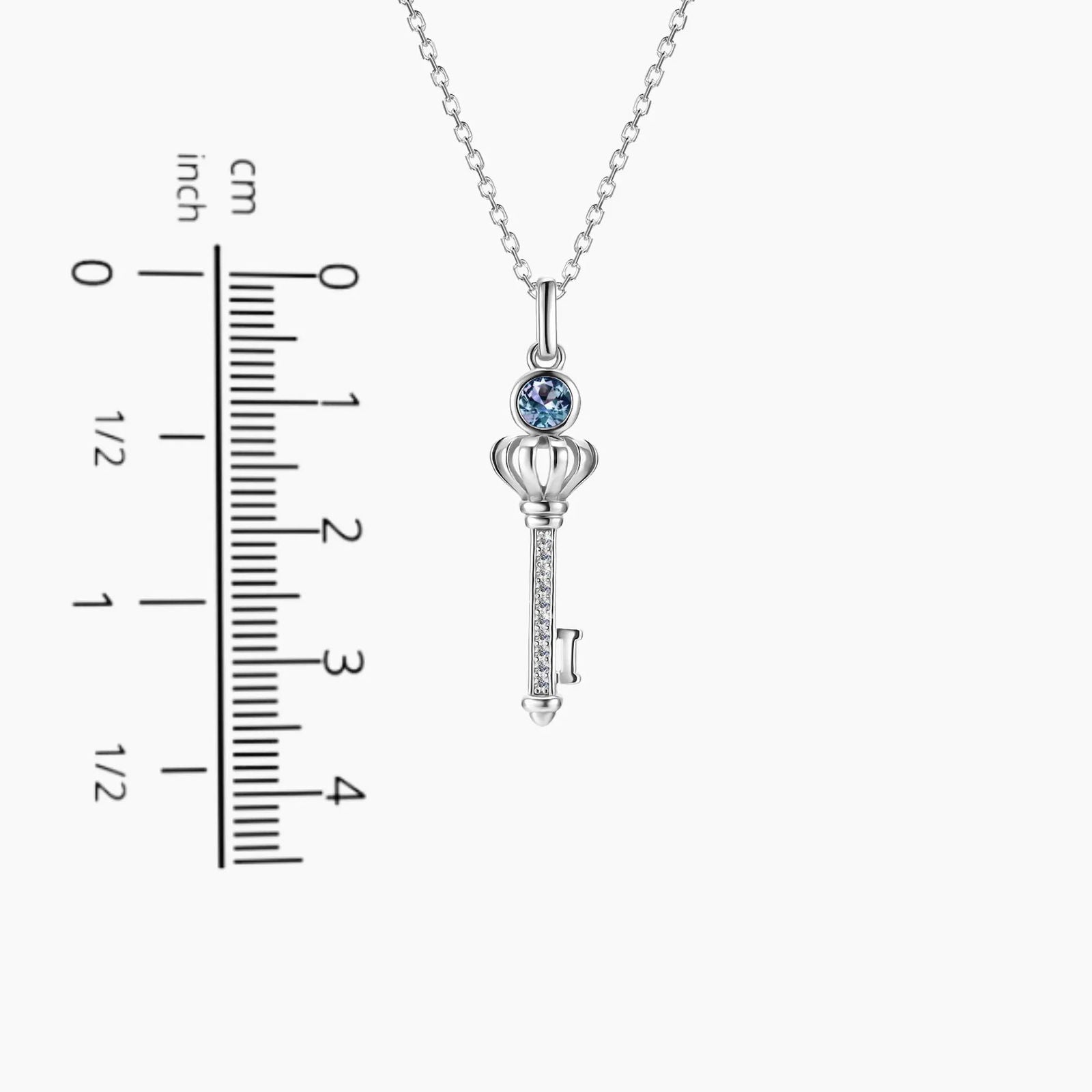 Alexandrite key pendant next to size chart – 3.5 cm height, 0.8 cm width