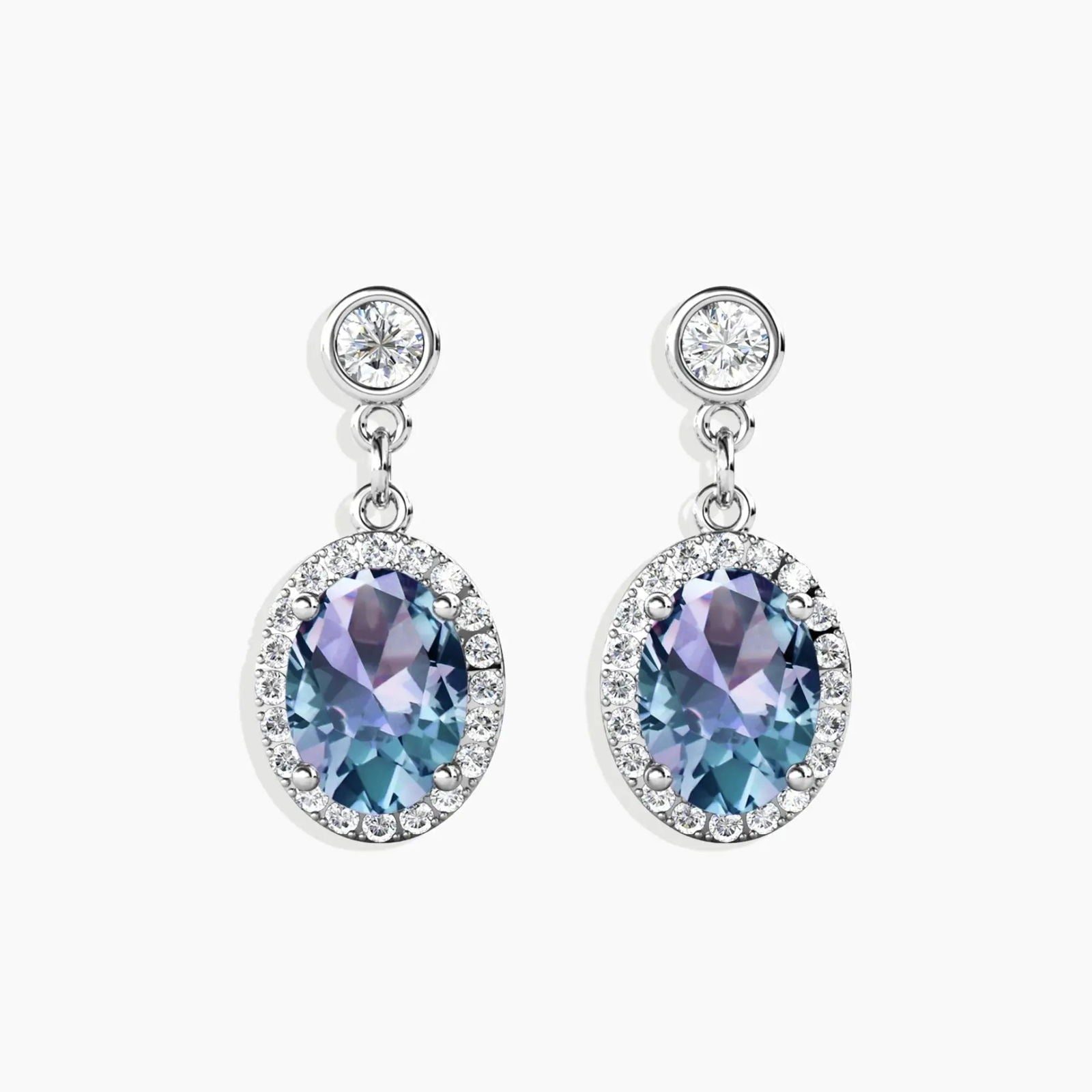 Front view of Alexandrite drop earrings with 7x9 mm oval gemstone and polished silver finish