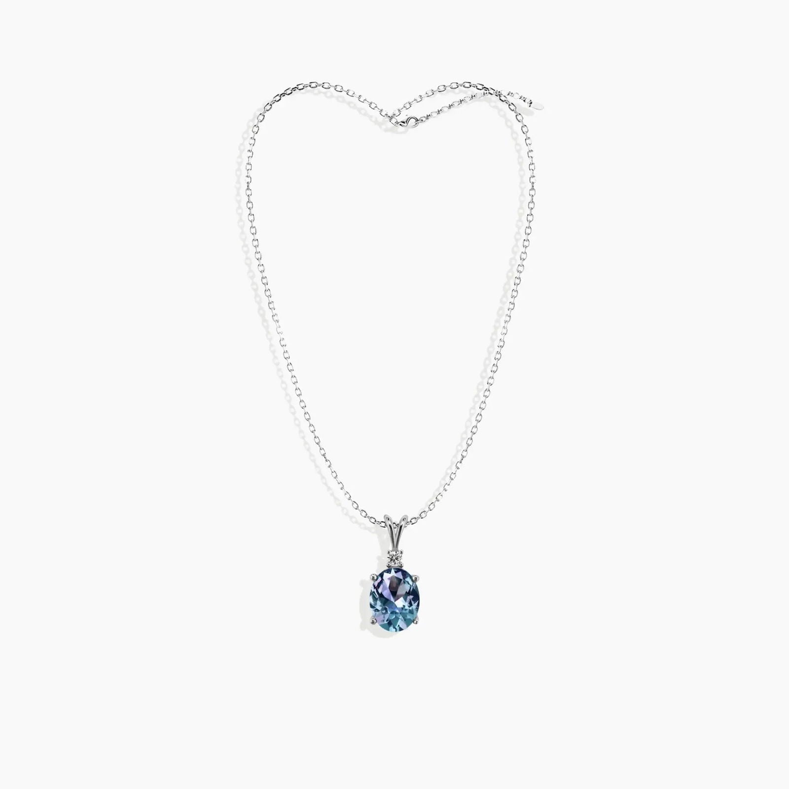 Alexandrite oval necklace laid flat showing full chain with clasp and gemstone pendant drop