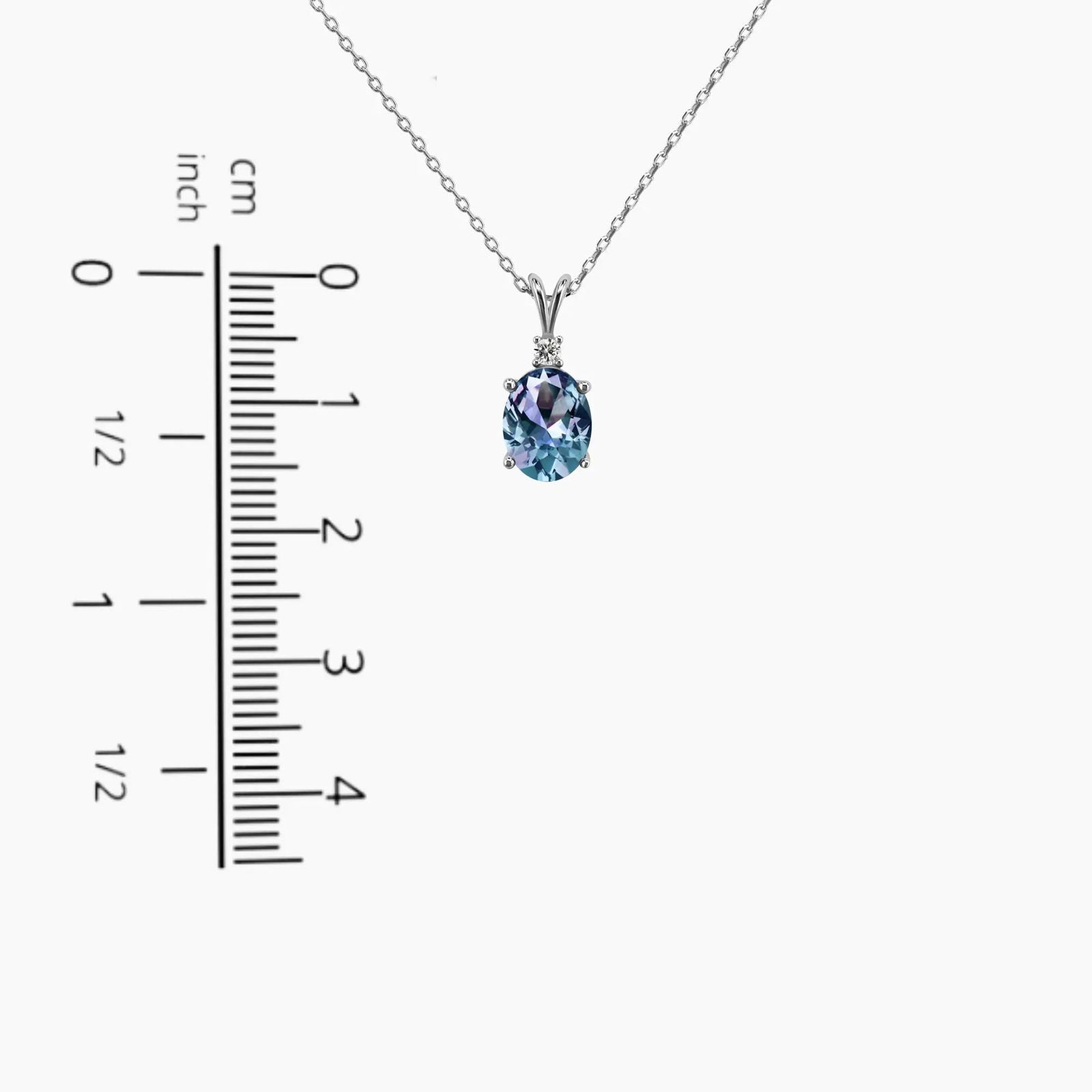 Alexandrite oval pendant necklace shown next to ruler – 1.6 cm height, 0.8 cm width