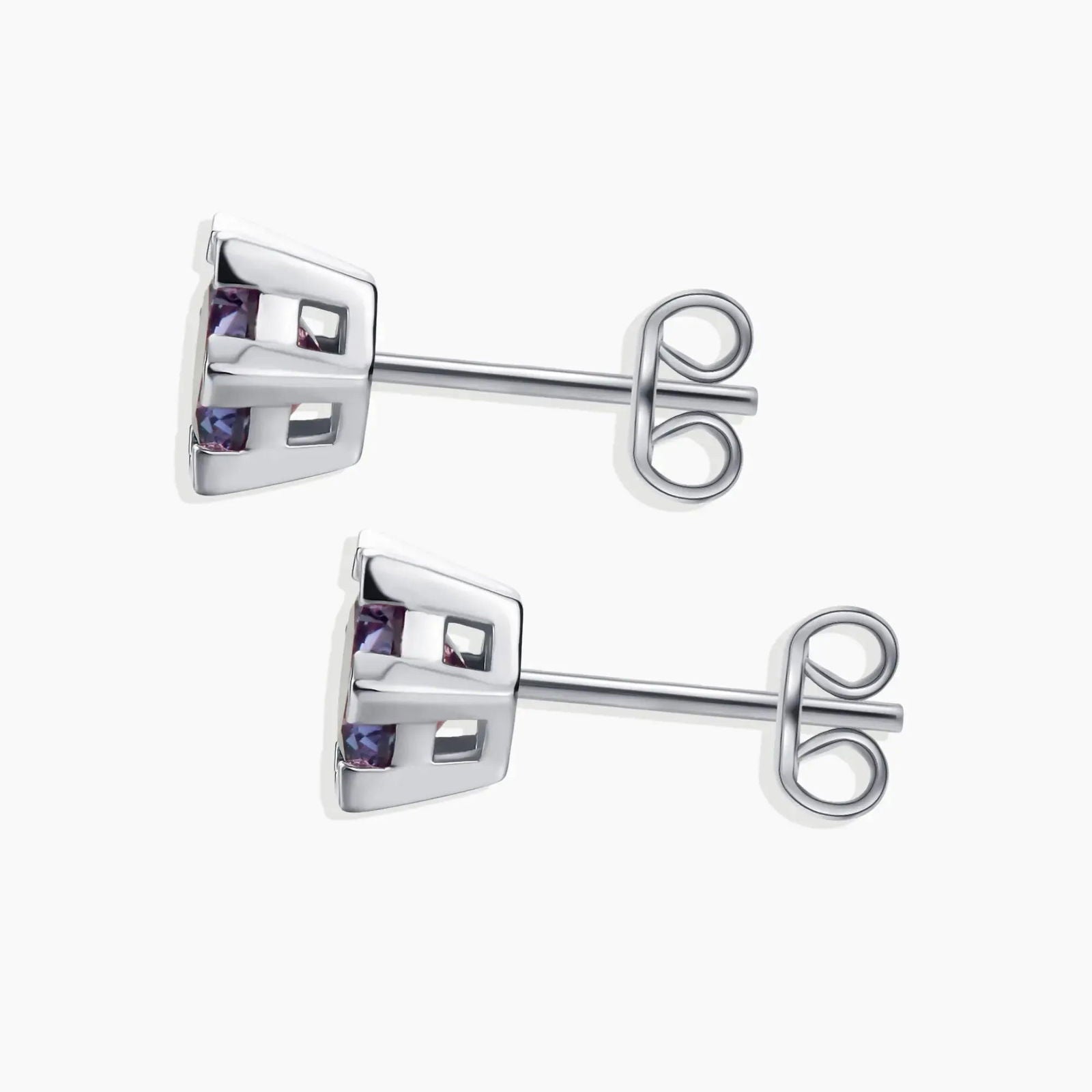 Alexandrite hexagon studs showing butterfly backing and clean geometric silver setting