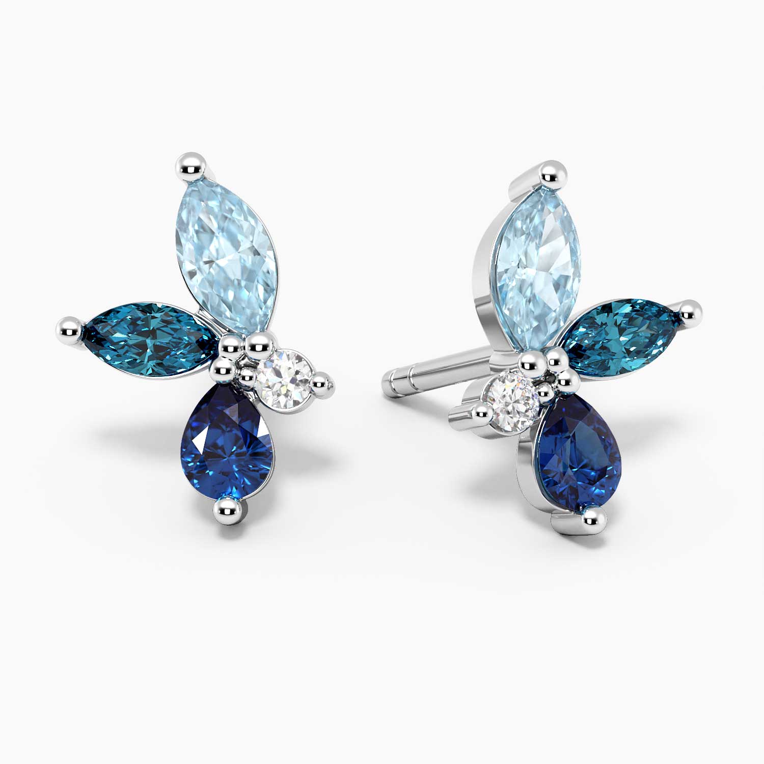 Cluster design earrings with sapphire, aquamarine, and topaz