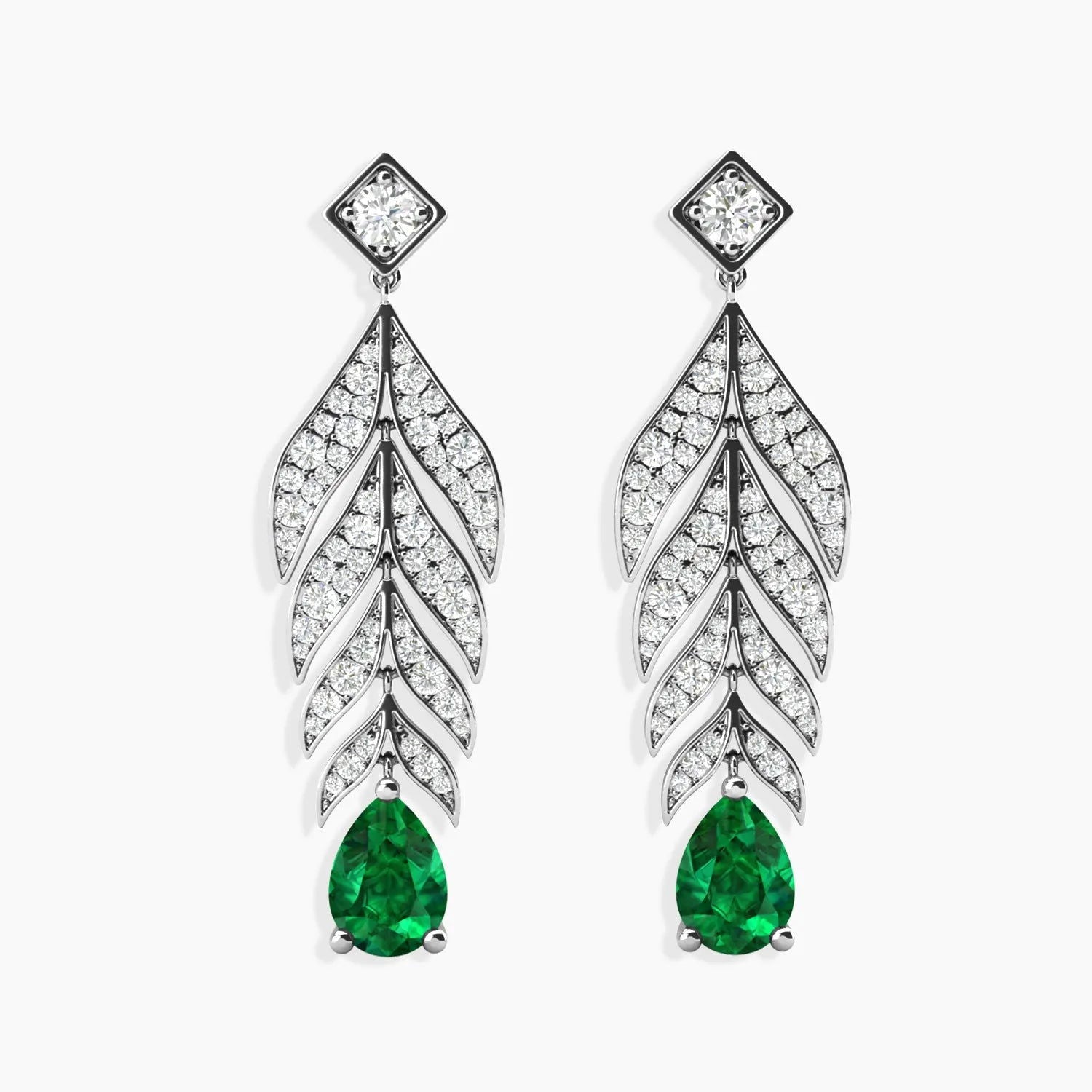 Sterling silver feather-motif drop earrings with pear-shaped emeralds on a white background.