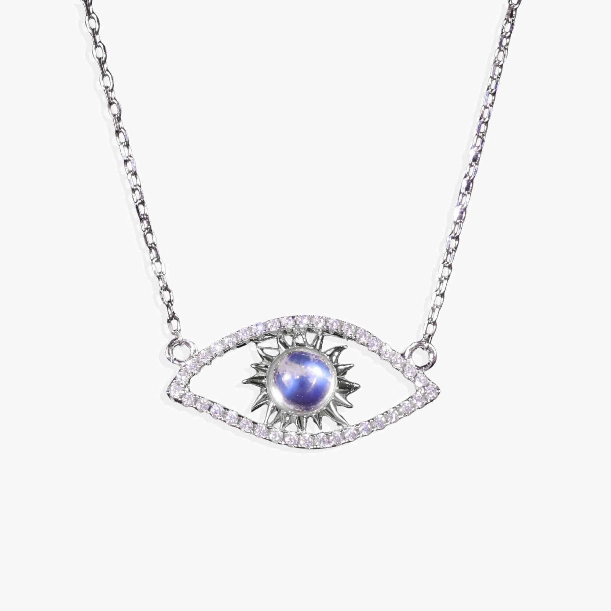 Necklace with eye-shaped pendant featuring a blue gemstone on a white background