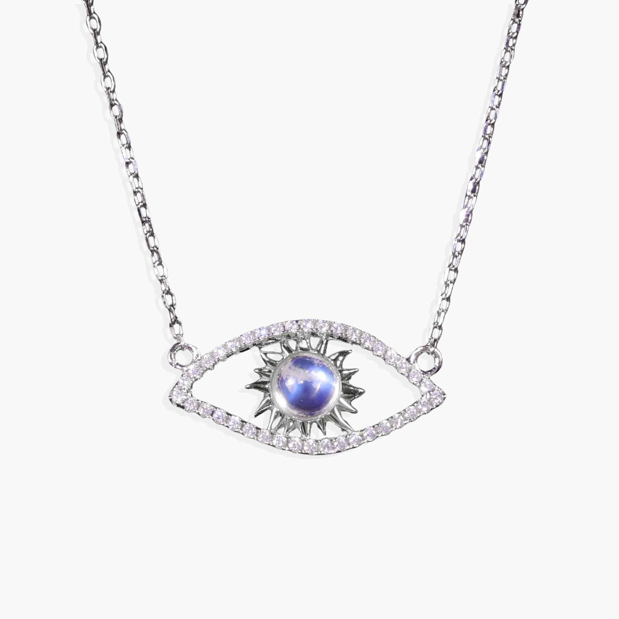 Necklace with eye-shaped pendant featuring a blue gemstone on a white background