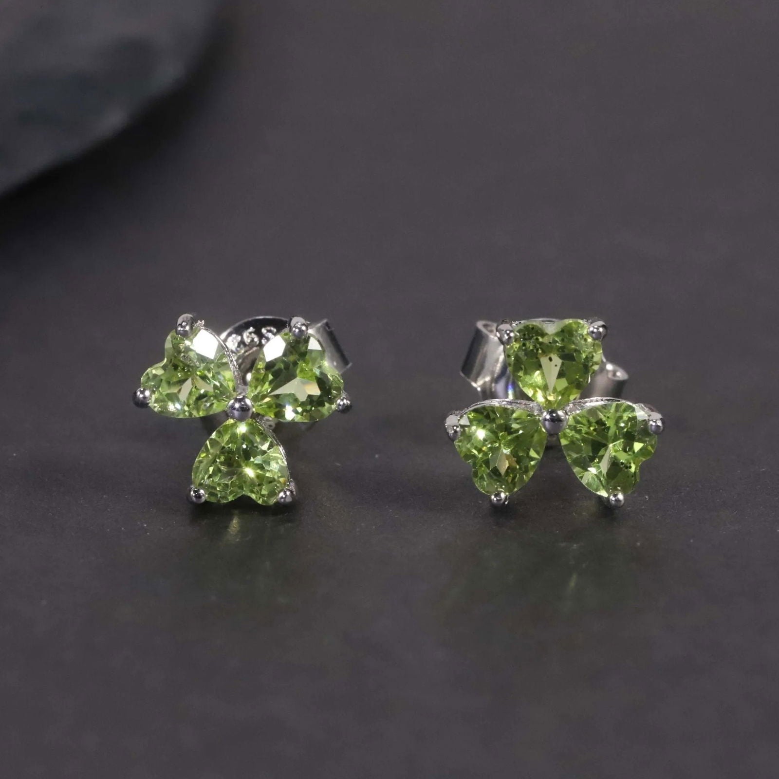 Close-up of Peridot Silver Stud Earrings – Flower Shape with Heart-Cut Gemstones
