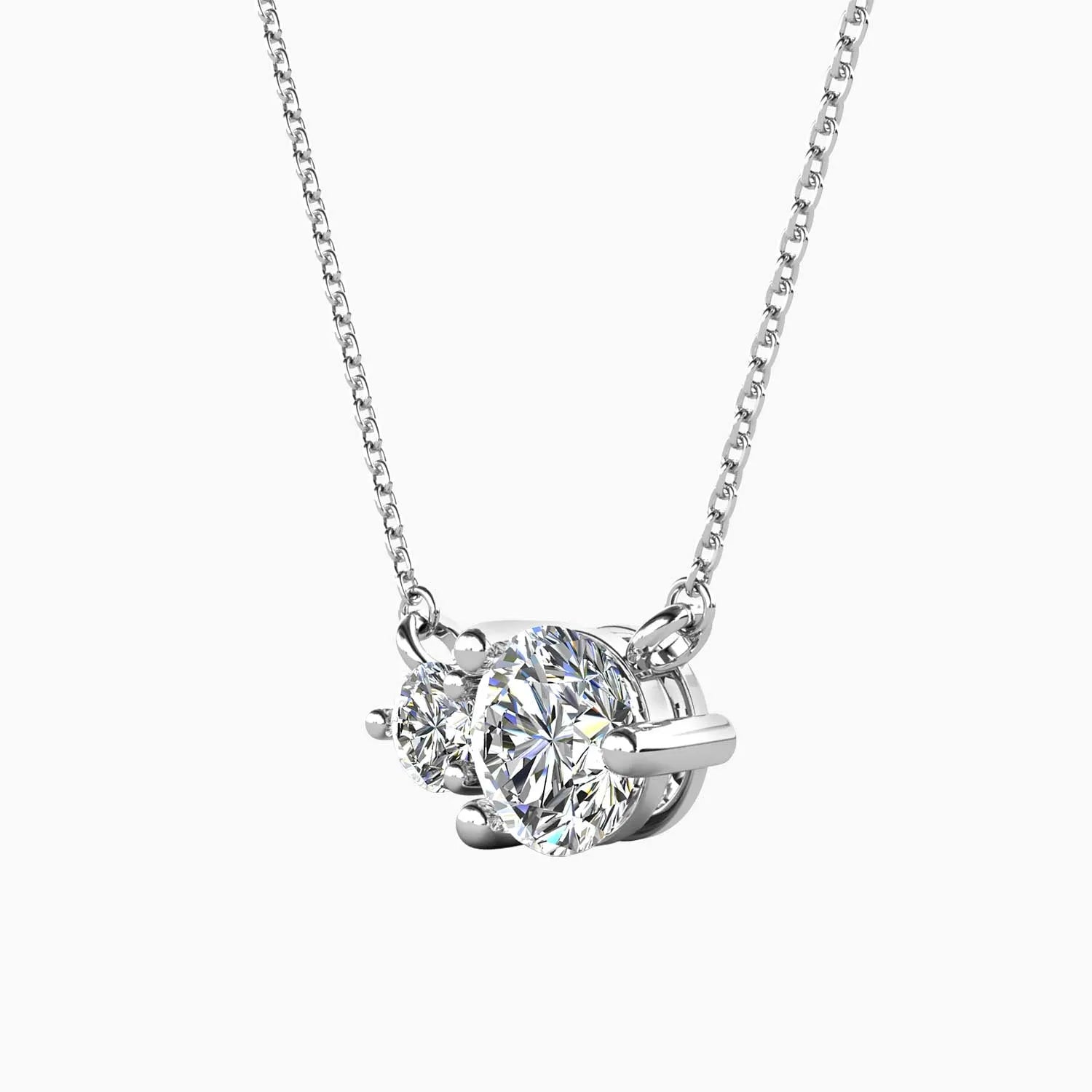 Front-facing view of the Moissanite Twin Pendant Necklace, highlighting its two round moissanite stones set in rhodium-plated sterling silver.