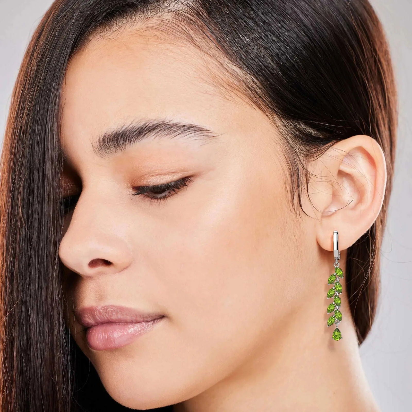 Model wearing Green Drop Earrings in Sterling Silver - August Birthstone Jewelry