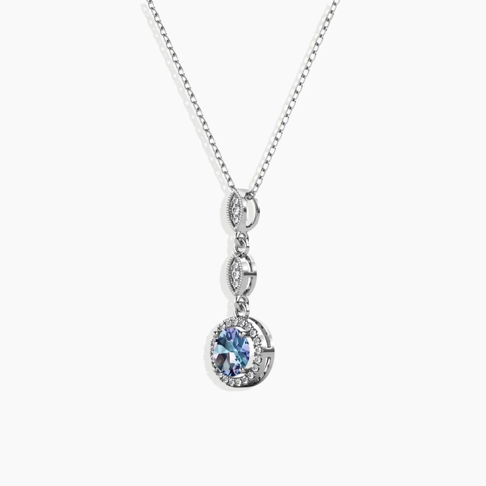 Alexandrite pendant necklace with colour-changing gemstone and sparkling accent stones on silver chain