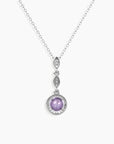 Alexandrite pendant showing gemstone’s transition from blue to purple under different lighting