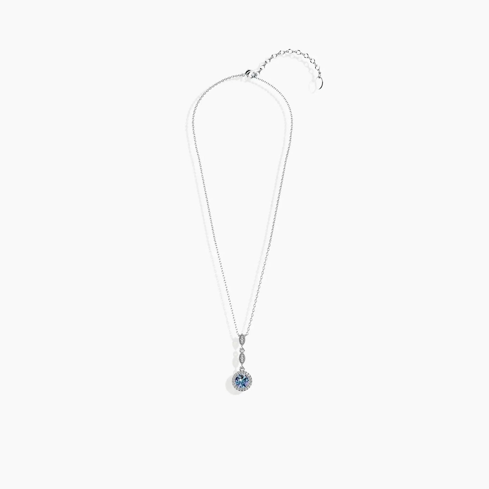 Full necklace laid flat with Alexandrite droplet pendant and extender chain visible