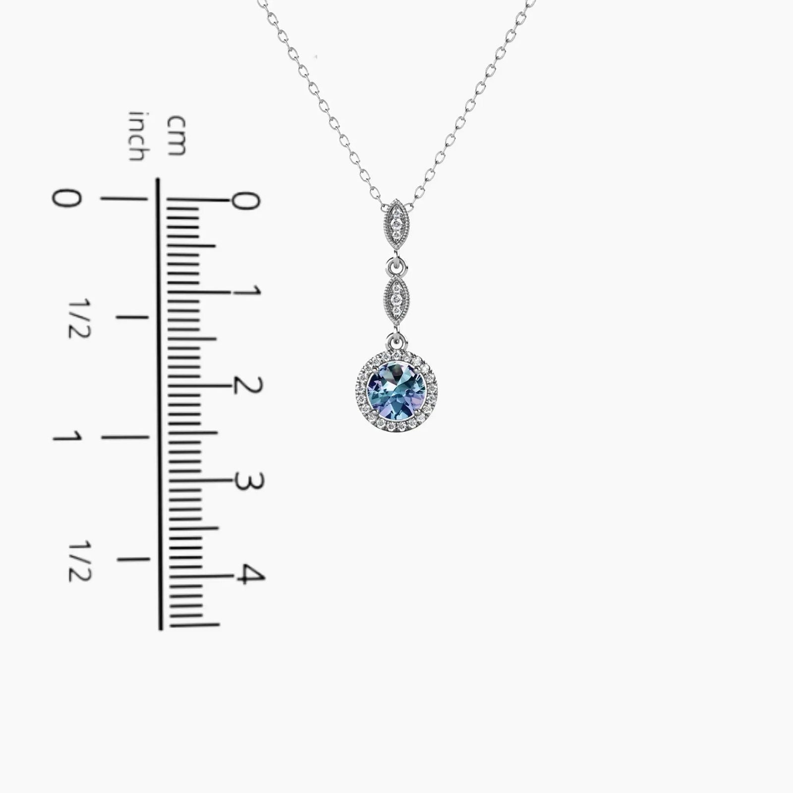 Round Alexandrite drop pendant shown with ruler – 2.5 cm height and 0.9 cm width