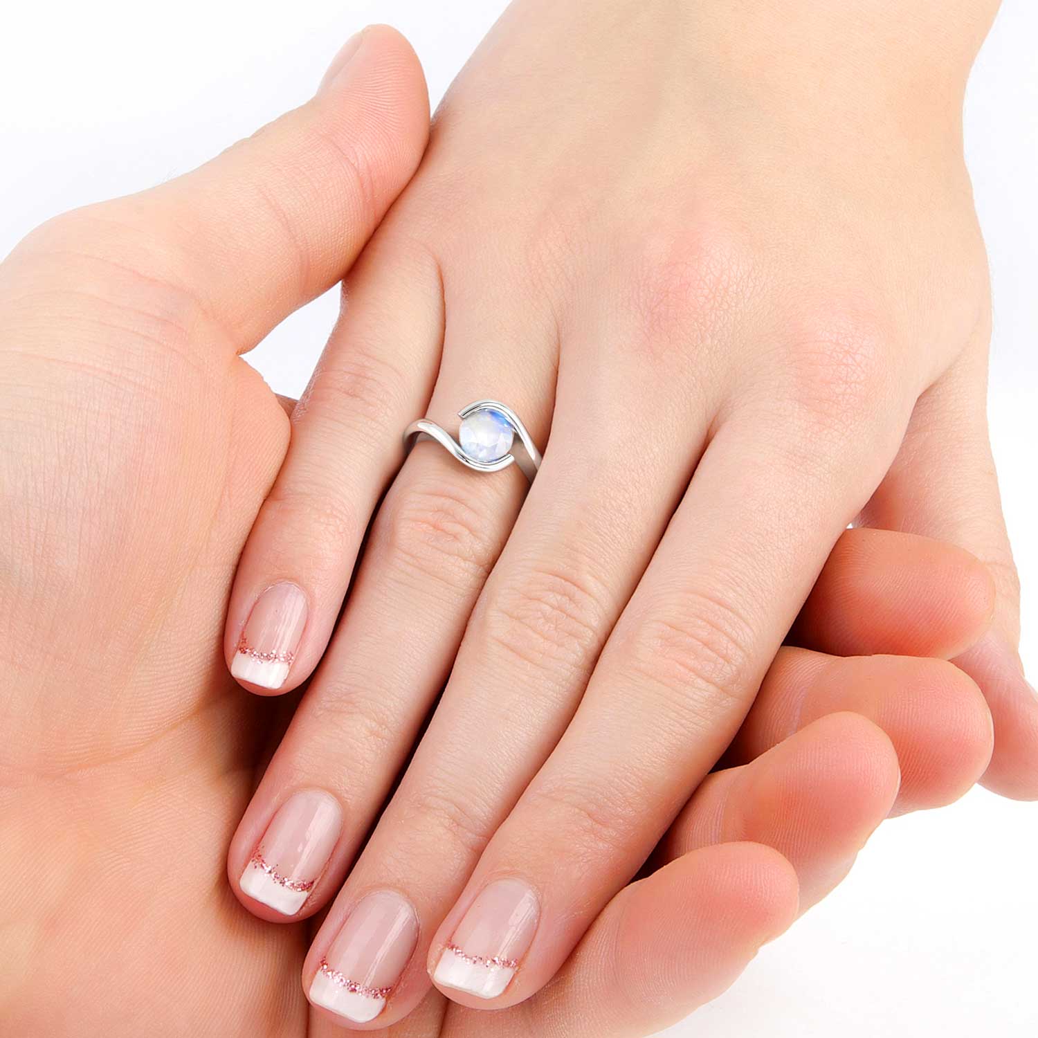 Model hand wearing the Irosk moonstone semi bezel ring, showcasing its elegant and modern curve design