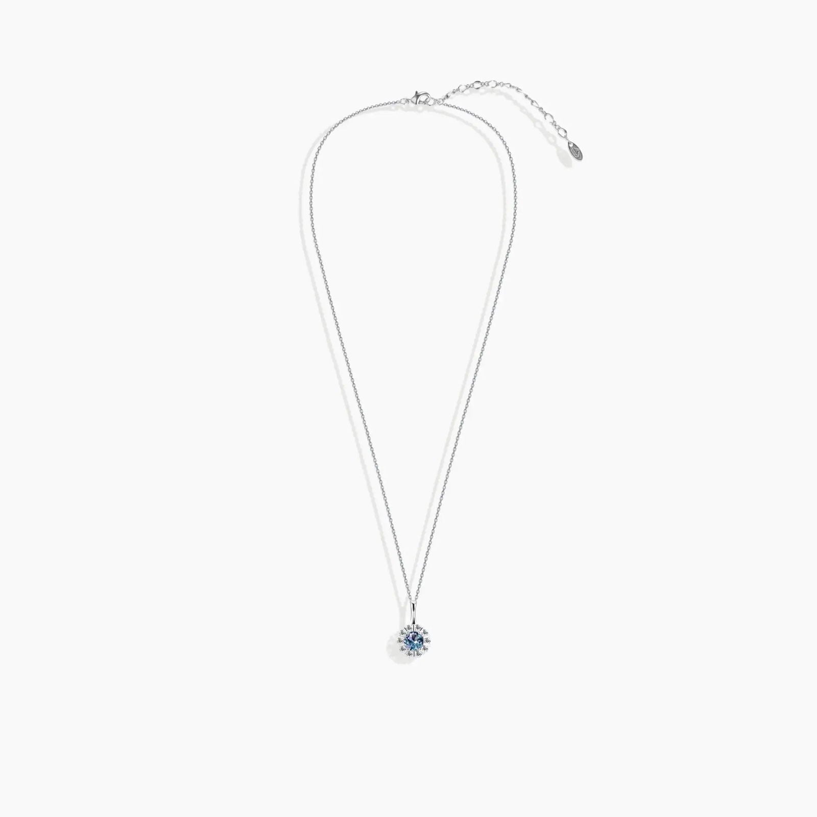 Full Alexandrite necklace laid flat showing halo pendant and adjustable extender chain