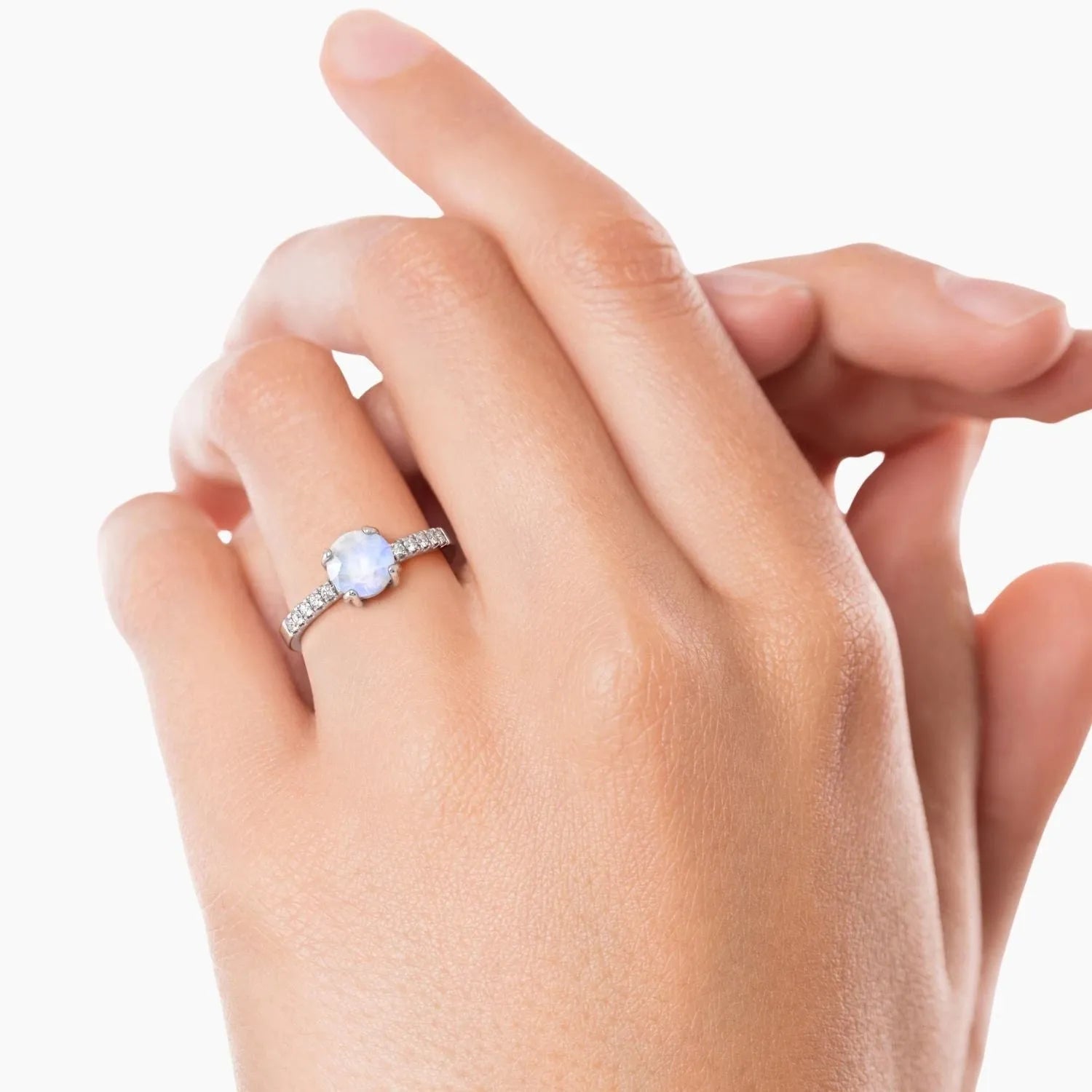 Moonstone solitaire ring worn on finger – elegant sterling silver birthstone ring for women