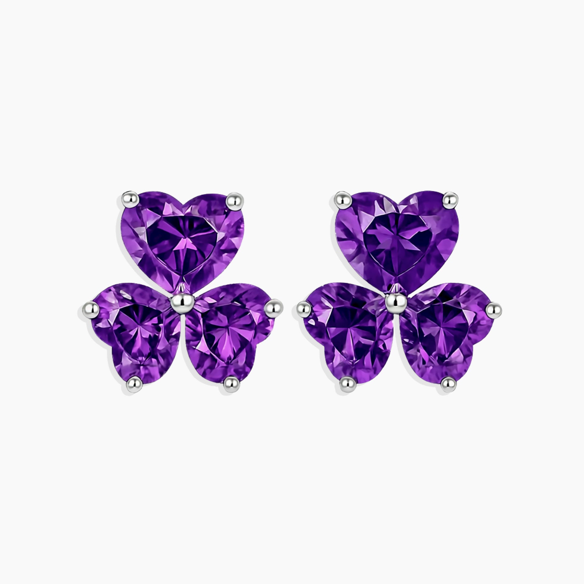 Purple butterfly-shaped earrings on a white background