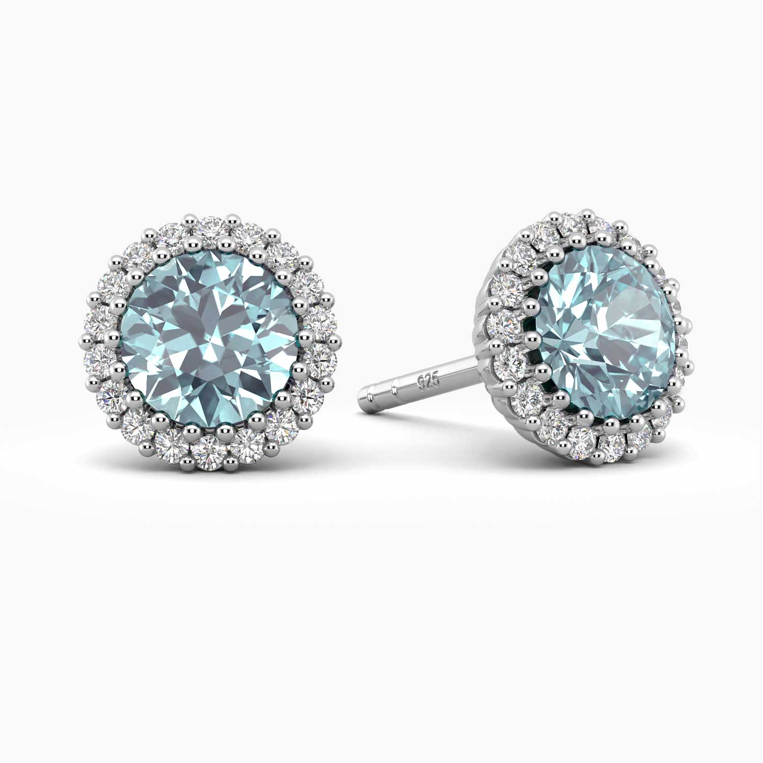 A pair of aquamarine halo stud earrings in 925 sterling silver with sparkling CZ accents.
