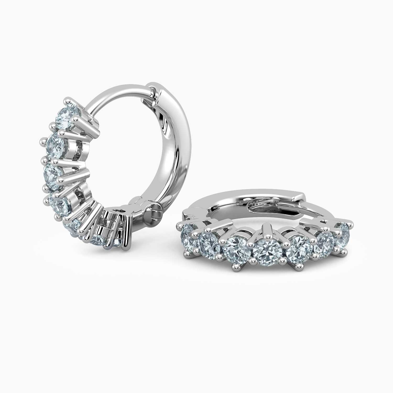 Pair of aquamarine huggie earrings in rhodium-plated sterling silver.