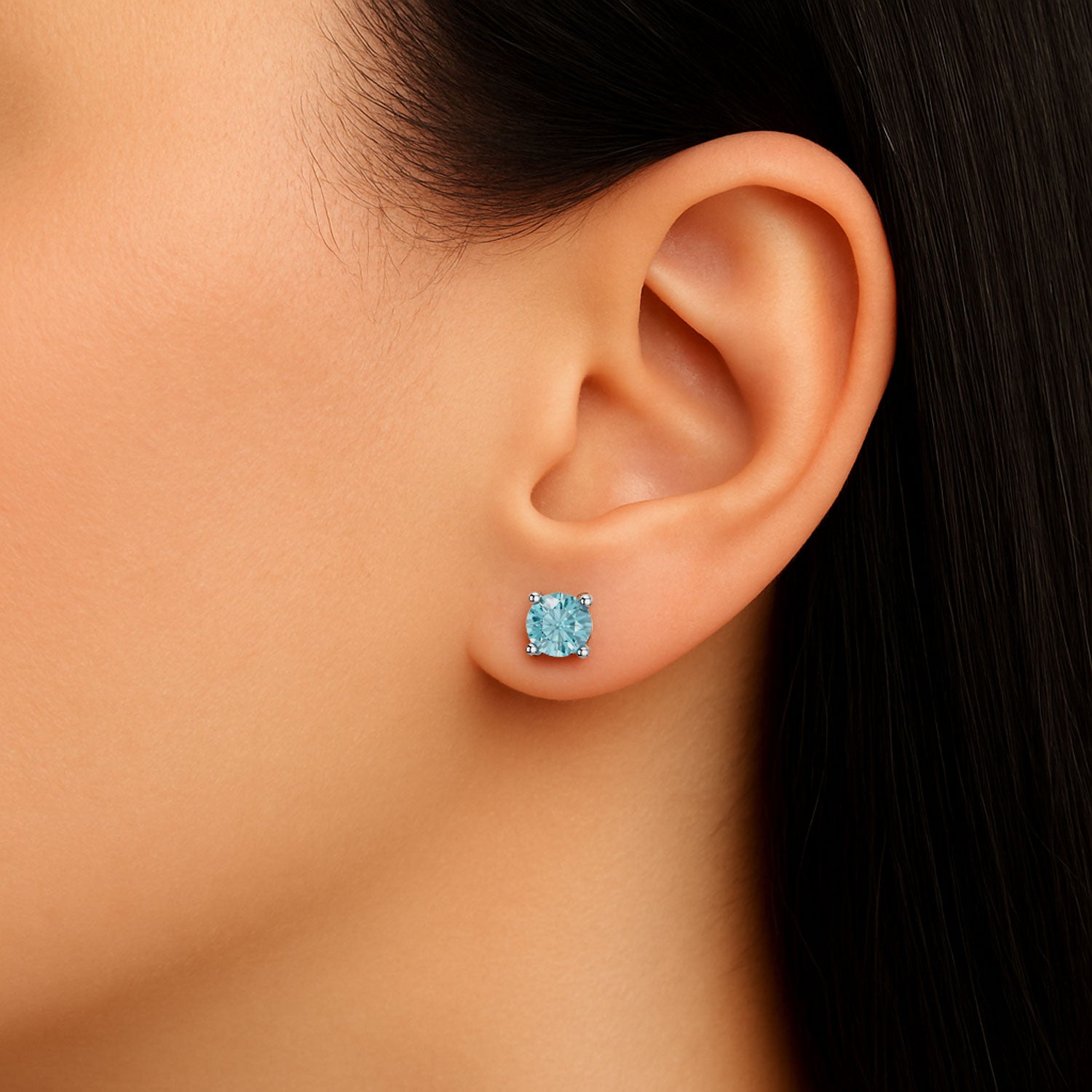 round aquamarine earrings on model