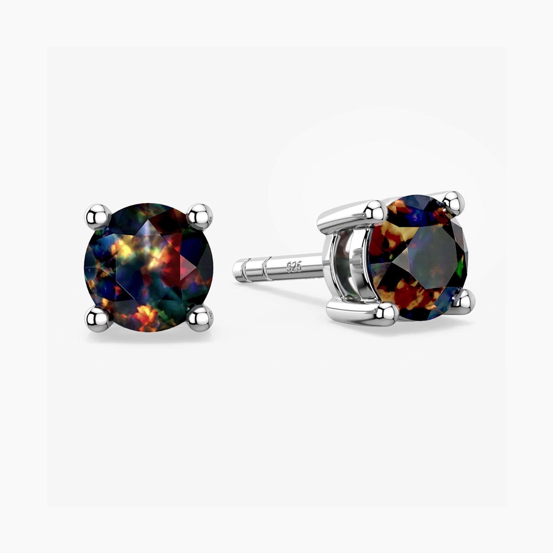 Pair of stud earrings with black opal gemstones on a white background