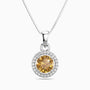 citrine pendant necklace with a clear chain on a white background