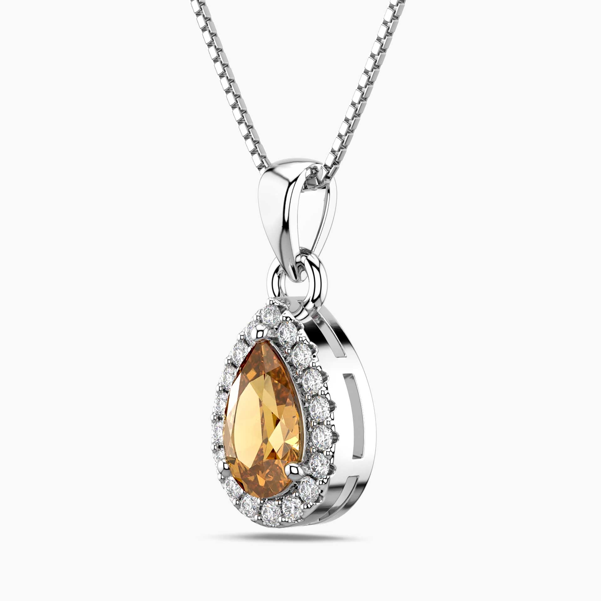 Silver pendant with a teardrop-shaped orange citrine gemstone and smaller clear stones on a white background