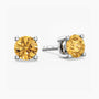Pair of yellow citrine gemstone stud earrings on a white background