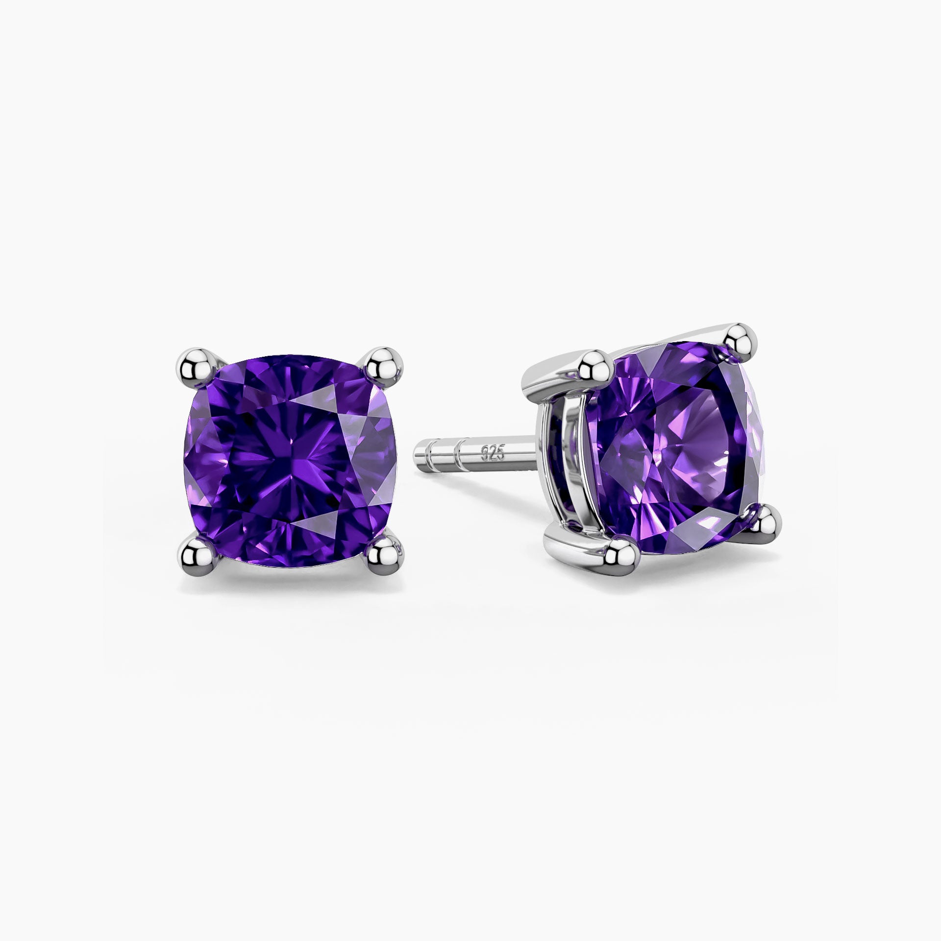 Cushion-cut amethyst stud earrings in sterling silver, showcasing deep purple gemstones in classic four-prong settings.