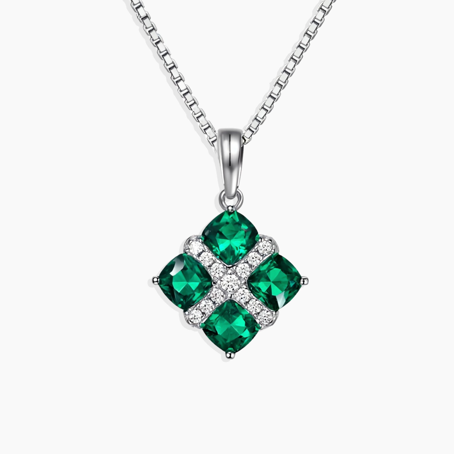 Lab-Created Emerald Cluster Pendant with four cushion-cut emeralds in rhodium-plated sterling silver on a 45 cm box chain.