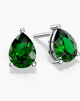 Teardrop-shaped emerald green stud earrings in silver claw setting