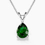 Teardrop-shaped emerald green pendant necklace in silver claw setting on a box chain