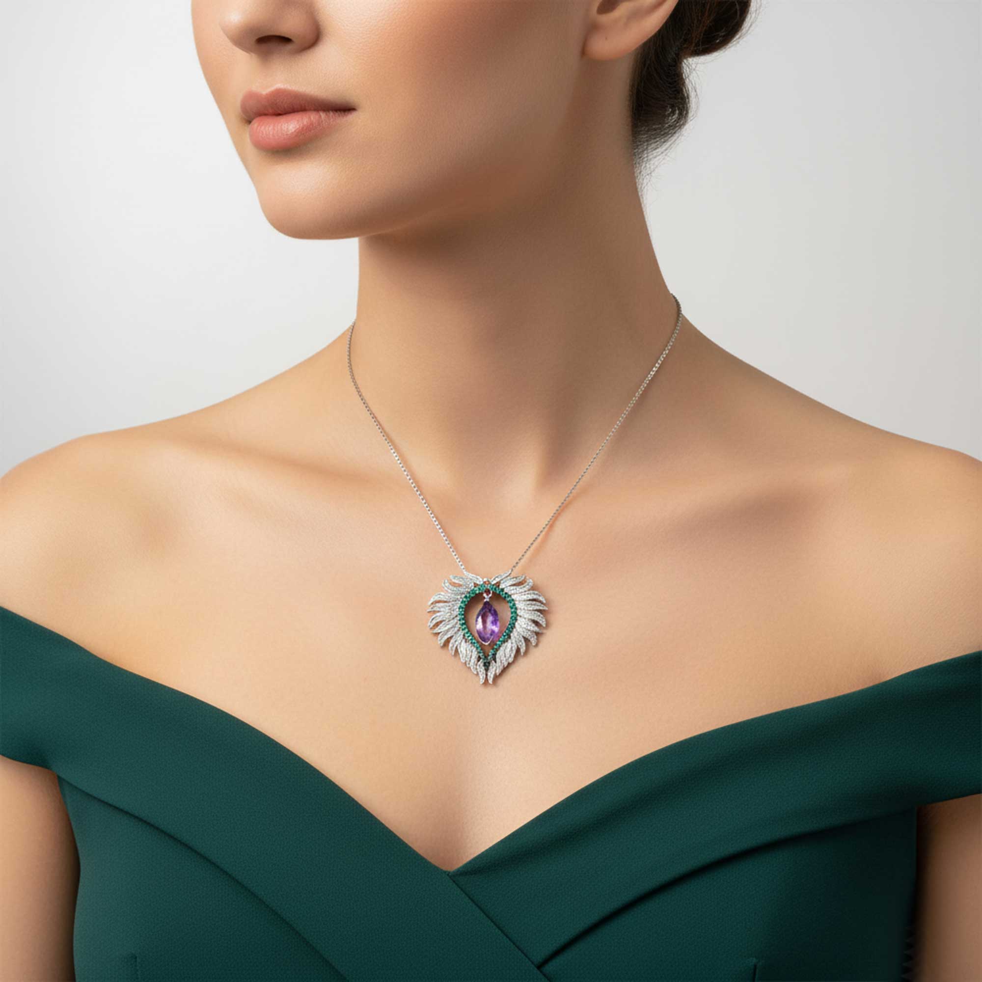 Woman wearing a necklace with a green dress on a neutral background