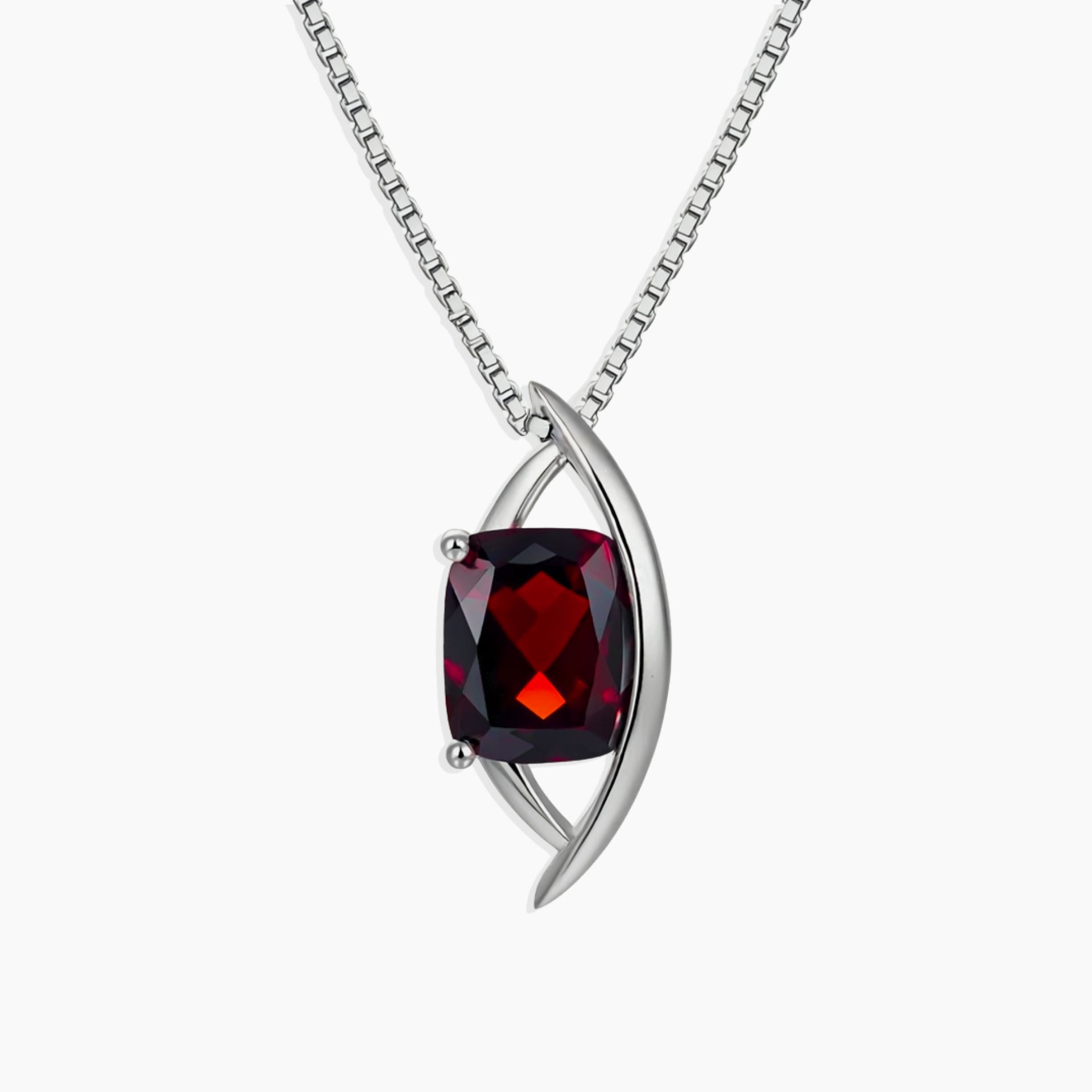 Sterling silver pendant necklace with cushion-cut natural garnet in a contemporary globe-style setting on a box chain.