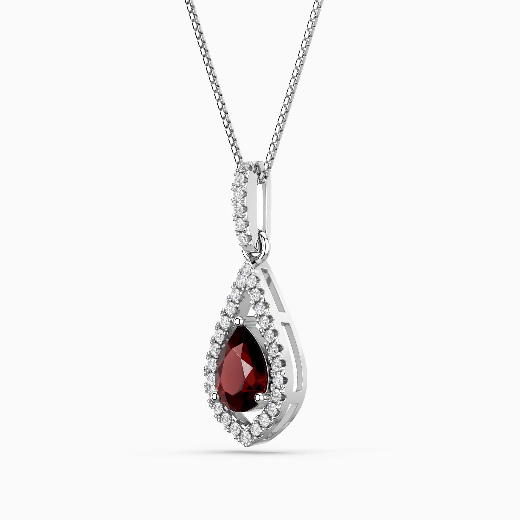 Teardrop-shaped pendant with a red gemstone and diamond accents on a white background
