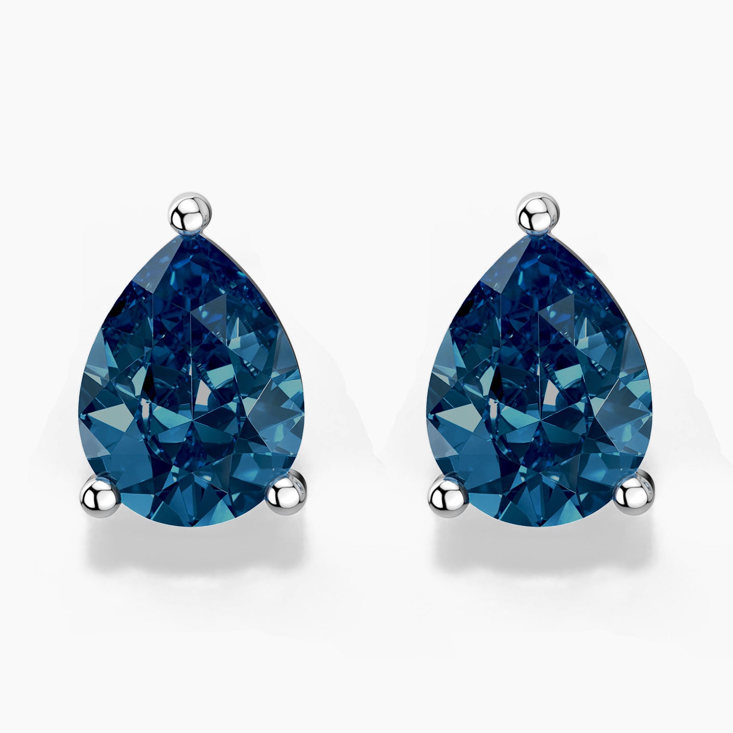 Pear-shaped London blue topaz stud earrings in sterling silver, front view.