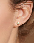model featuring opal earirngs gold