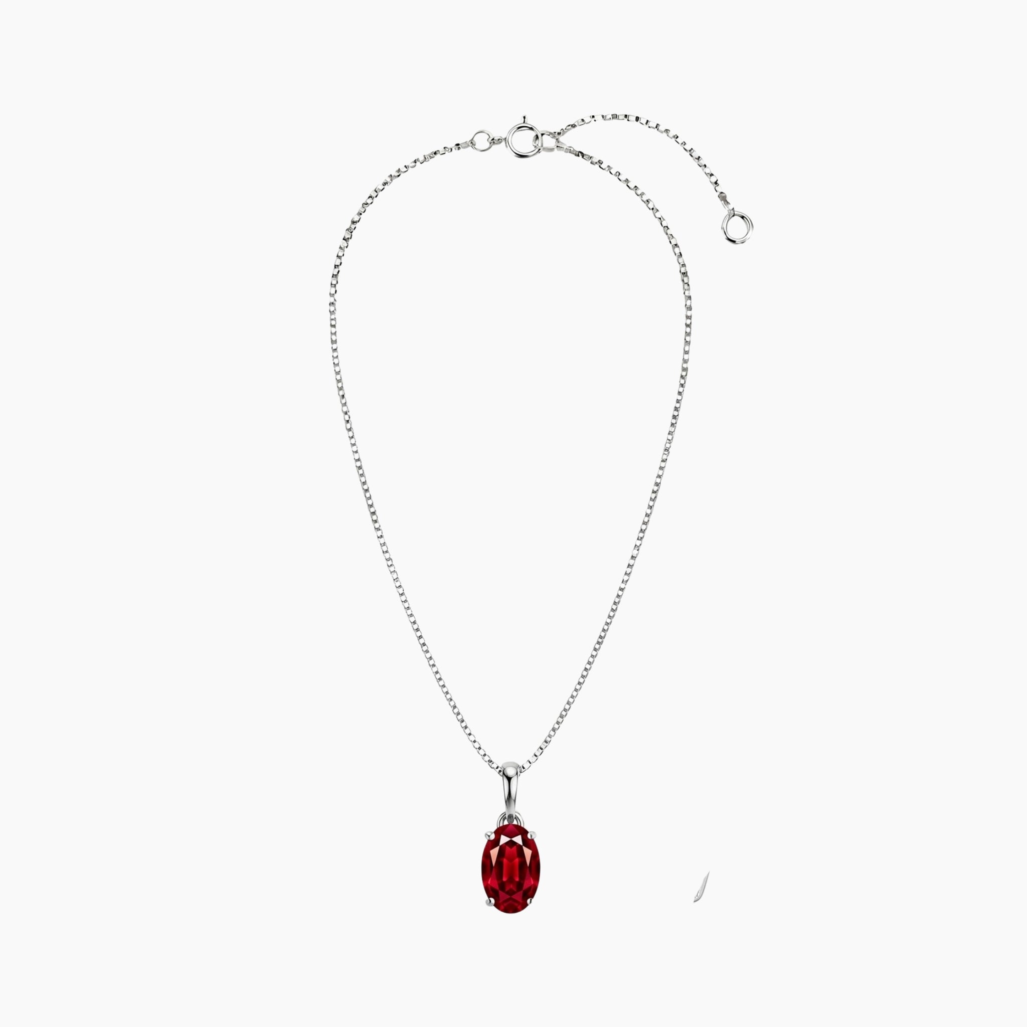 Silver necklace with a red pendant on a white background