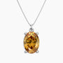 Oval-cut golden yellow citrine pendant in a four-prong silver setting, hanging from a polished silver box chain, displayed on a white background.