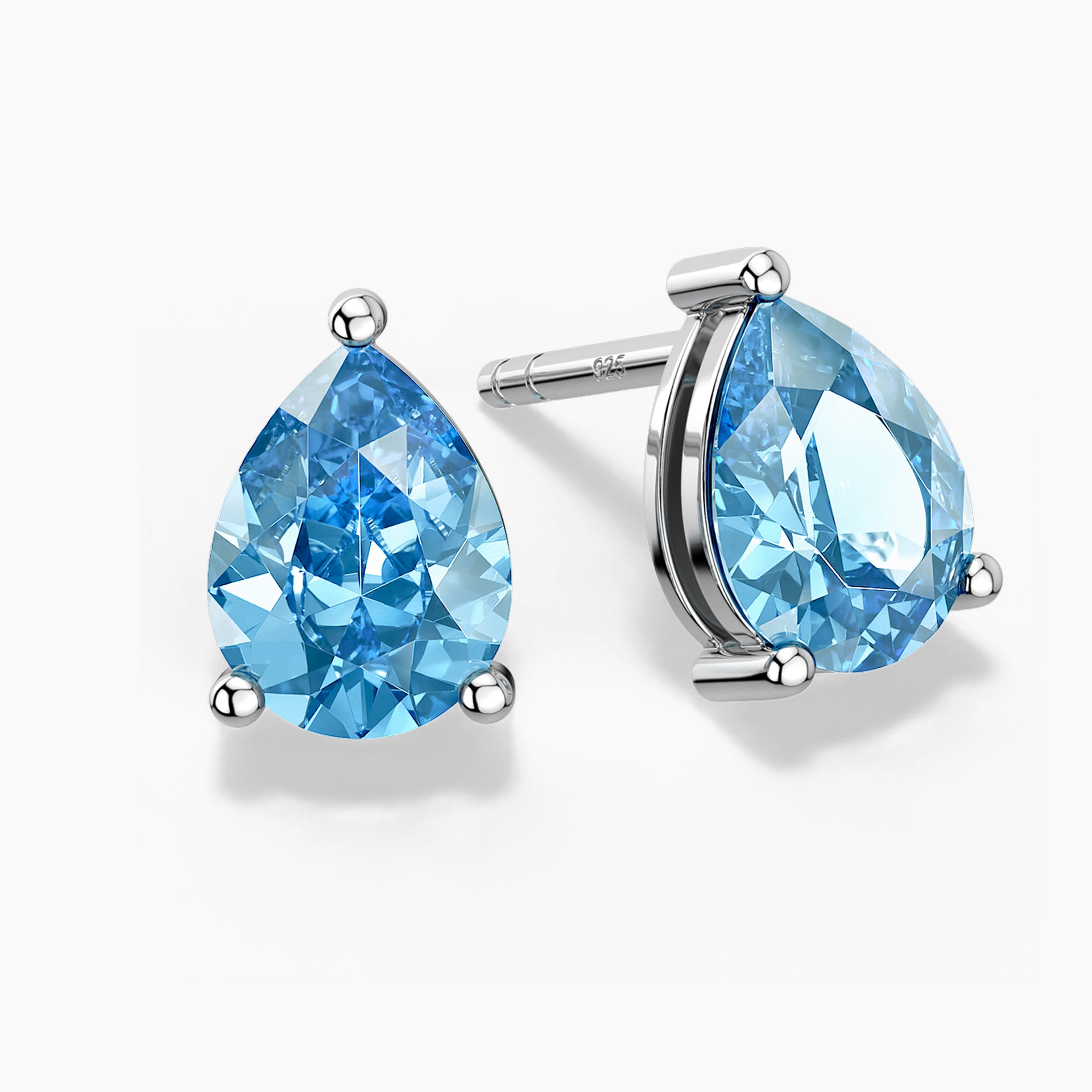 A pear-shaped Swiss blue topaz pendant in a three-prong sterling silver setting with a V-shaped bail, hanging from a fine silver box chain; the gemstone sparkles with bright sky-blue hues against a white background.