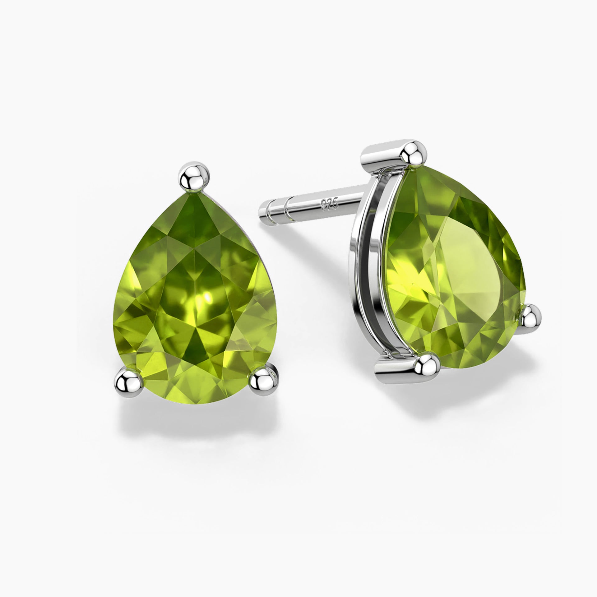 Two pear-shaped bright green peridot gemstones set as sterling silver stud earrings, one shown head-on and the other at a slight angle, each secured by three polished prongs on a white background.