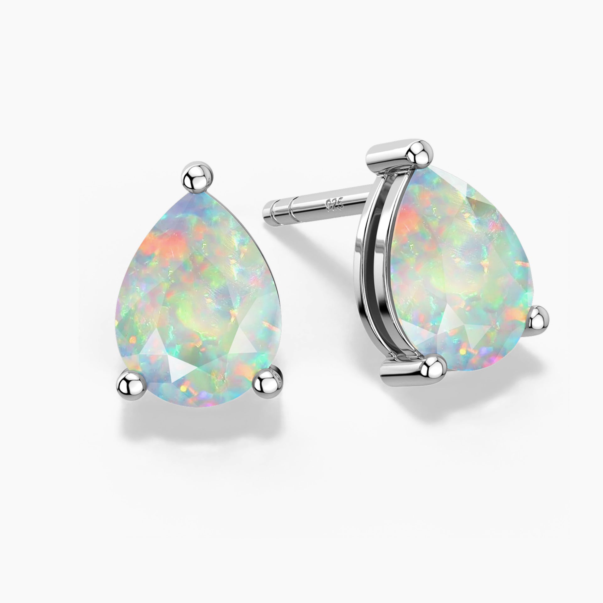 Two pear-shaped white opal stud earrings in three-prong sterling silver settings—one shown head-on and the other at a slight angle revealing the “925” stamp on the post—displaying soft pastel flashes of green, pink, and blue play-of-color on a white background.