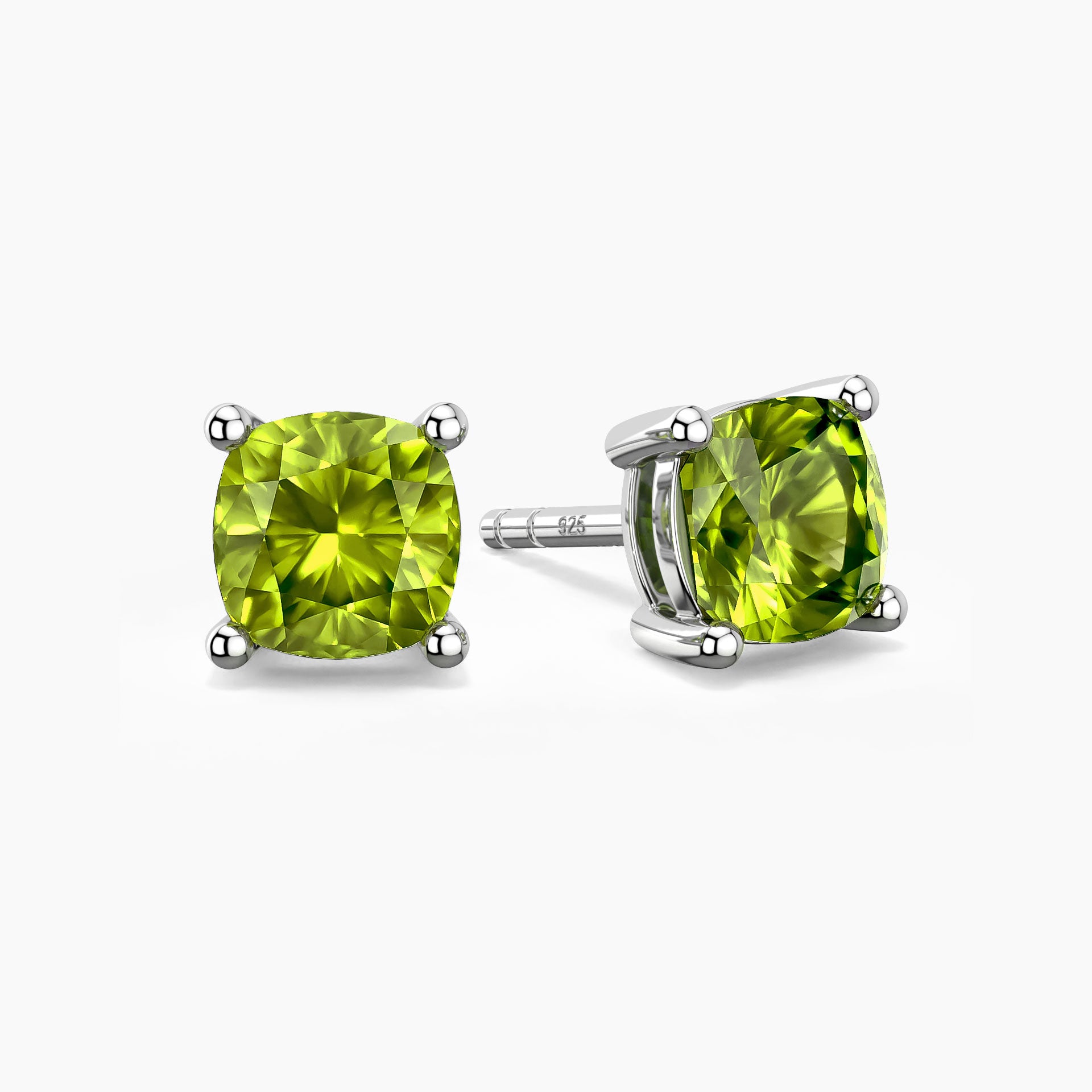 Pair of sterling silver stud earrings featuring cushion-cut green peridot gemstones with four-prong settings.