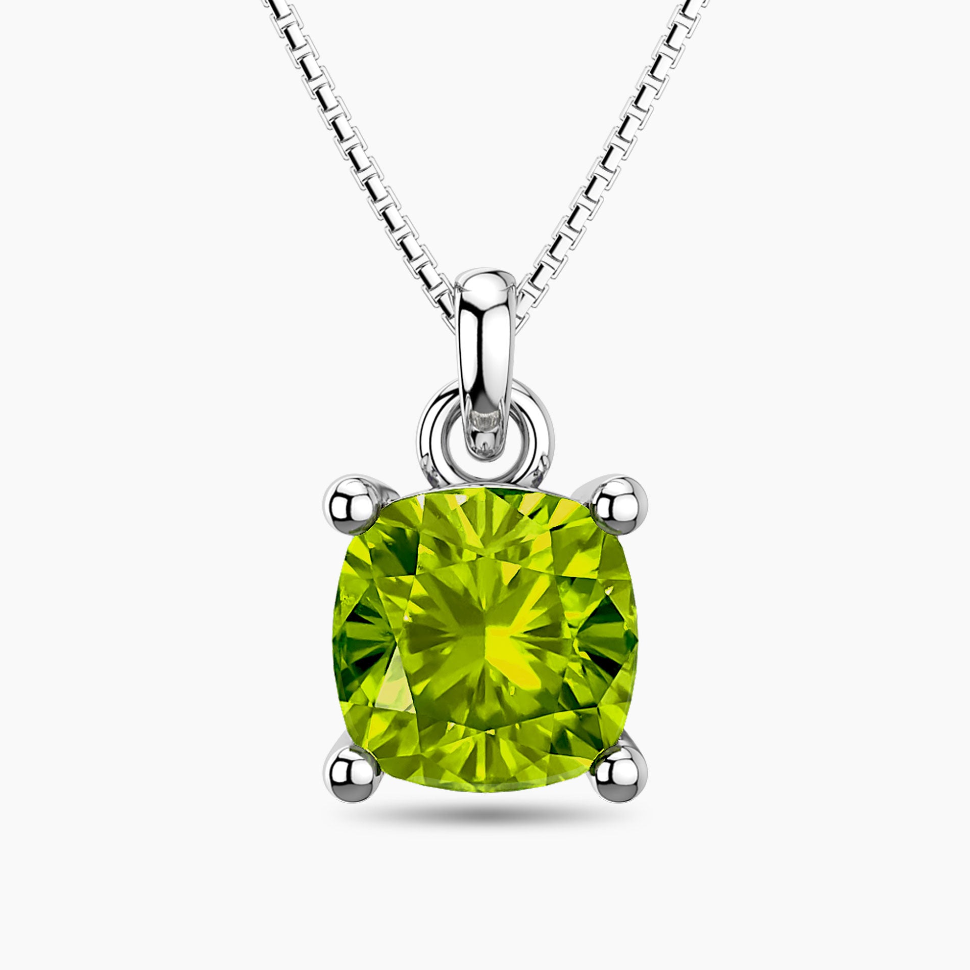 Sterling silver necklace featuring a cushion-cut green peridot pendant in a four-prong setting on a box chain.