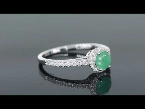 Video preview of the sterling silver round-cut emerald halo ring, showcasing its halo design and sparkling CZ accents.