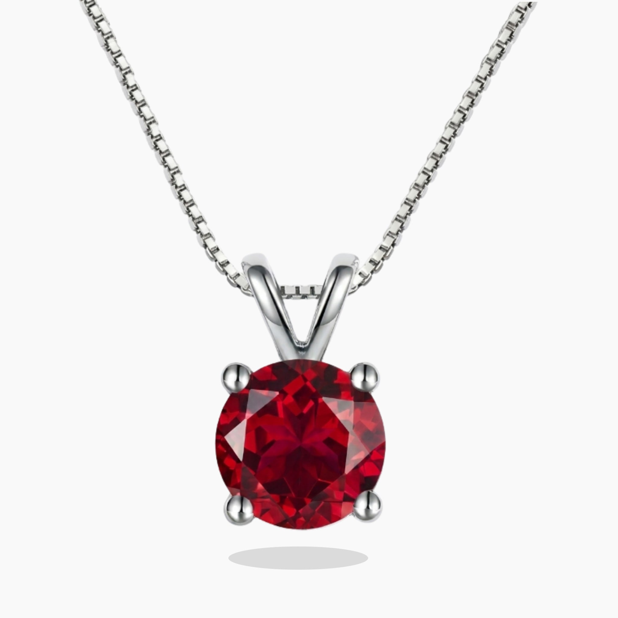Red ruby gemstone necklace on a white background